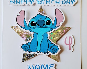 May include: A blue Stitch character from Disney's Lilo & Stitch sits on a gold star with a pink glitter background. The card says "Happy Birthday" and "NAME" in blue letters. A pink number 4 is in the top right corner.