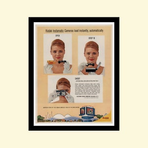 May include: A vintage Kodak Instamatic camera advertisement featuring a woman using the camera. The ad text reads "Kodak Instamatic Cameras load instantly, automatically" and "Another star of the Kodak World's Fair of Picture Taking".