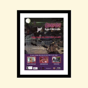 May include: A video game advertisement for Scooby-Doo! Night of 100 Frights for the Playstation 2. The image features Scooby-Doo in a graveyard setting with a spooky background. The text on the ad reads "Scooby-Doo! Night of 100 Frights" and "Raggy, Raphne, Red, Reimo? Where are you?"