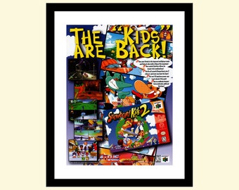 Vintage 1990s Snowboard Kids 2 snowboarding video game ad framed, retro advertisement: Nintendo 64 1999 90s