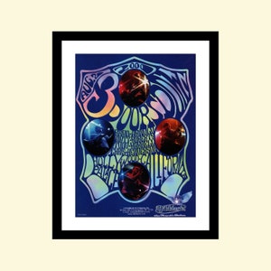 May include: Framed concert poster with a blue background and a psychedelic design. The poster features the text "3 Doors Down" and the date "2000". It also includes images of the band members and the venue, Hollywood Palace, California.