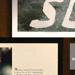 May include: A close-up of a gray matboard with the word "Uncut" printed in white. The matboard is on a wooden surface.