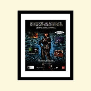 May include: A video game advertisement for Ghost in the Shell: Stand Alone Complex, featuring a female character in a black and gray suit, with the text "Coming this November" in a red box. The game is for PlayStation 2.