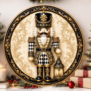 May include: A circular wall plaque featuring a nutcracker soldier in a black and gold uniform with a black and white checkered pattern. The soldier holds a lantern and is set against a cream-colored background with gold filigree and a black frame.