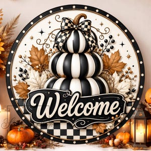 May include: A circular wall sign featuring a stack of three black and white striped pumpkins topped with a matching checkered bow. The sign has a black border with white dots and a black banner across the center with the word Welcome in white.
