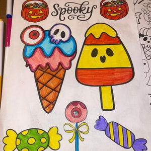 May include: A coloring page with the word "Spooky" in a whimsical font. The page features various Halloween-themed images, including a candy corn, a pumpkin bucket, an ice cream cone with a skull, a lollipop with an eye, and two candy pieces.