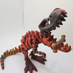 Juguete de escritorio con esqueleto de T-rex totalmente articulado para TDAH con boca que se abre y se cierra. Incluye hueso.
