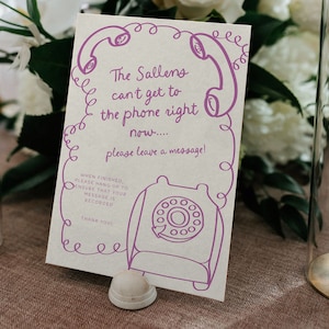 Może przedstawiać: Biała kartka z fioletowym rysunkiem telefonu i tekstem "The Sallens can't get to the phone right now.... please leave a message!"  When finished, please hang up to ensure that your message is recorded. Thank you!