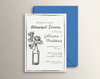 May include: A white invitation card with black handwritten text and a floral illustration, accompanied by a blue envelope. The card announces a rehearsal dinner for Lilliana and Matthew, with date, time, and location details.