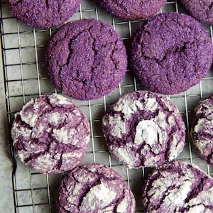 May include: Purple ube sugar cookies on a wire rack. The cookies are soft and chewy. "littleepicurean NEW POST! It's here! I'm finally sharing the recipe for my soft and chewy ube sugar cookies! Recipe gives you the option to roll the cookie... more" is written below the image.