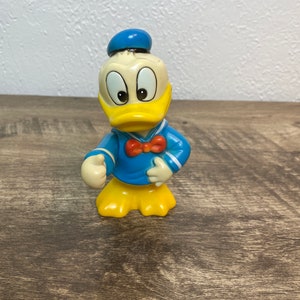 70s Donald Duck coin bank