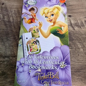 May include: A Disney Tinkerbell Valentine's Day set with the text "16 Valentines with 16 Lenticular Bookmarks". The cover features a purple floral design and an illustration of Tinkerbell. Suitable for ages 3 and over.