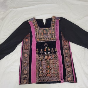 An old dress from the Majdal/Gaza region cut and sewn into the shape of a tunic