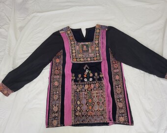 An old dress from the Majdal/Gaza region cut and sewn into the shape of a tunic