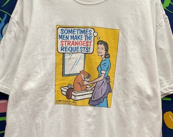 vintage, not a single stitch, graphic T-shirt with cartoon, graphic, funny, cartoon graphic of housewife, washing beaver