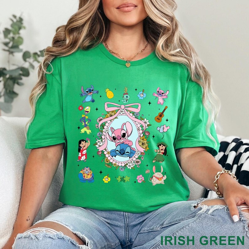 May include: Green t-shirt with a vibrant cartoon graphic. The design showcases a central oval frame with two characters, surrounded by flowers and other character illustrations. The text "IRISH GREEN" is at the bottom of the image.