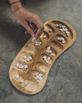 MANCALA / teak wood hand carved game / Bali product logo