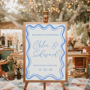 Modèle Canva de plaque de bienvenue de mariage, bordure ondulée aquarelle bleue française pour une élégante enseigne côtière grande gribouillis dessinés à la main 07