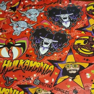 May include: Red and white stickers with various wrestling-themed designs, including a wrestler's mask, a heart with a wrestler's face, a bull's head, a wrestler's face in a star, and the text "HULKAMANIA" and "TATTOO GINGLES".