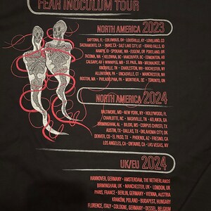 May include: Black and red graphic design with the word "TOOL" in white lettering. The text "FEAR INOCULUM TOUR" is below the word "TOOL". The graphic design includes a list of cities and states in North America for the "TOOL" tour in 2023 and 2024. The graphic design also includes a list of cities and countries in Europe for the "TOOL" tour in 2024.