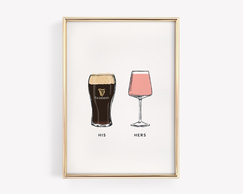 May include: A framed print featuring two illustrated glasses: a pint of Guinness and a pink cocktail. The words "HIS" and "HERS" are printed below the glasses. The print is in a gold frame.