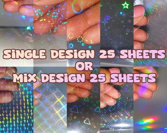 May include: A collage of eight iridescent holographic sheets with different patterns, including hearts, stars, and geometric shapes. The text "SINGLE DESIGN 25 SHEETS OR MIX DESIGN 25 SHEETS" is displayed on the image.