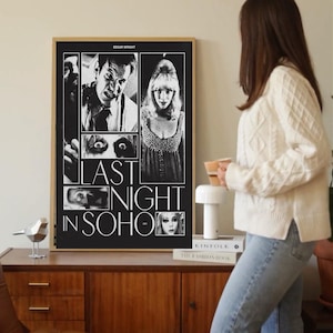 May include: A black and white framed movie poster for "Last Night in Soho" featuring images of actors and the film's title. The poster is displayed on a wooden cabinet.