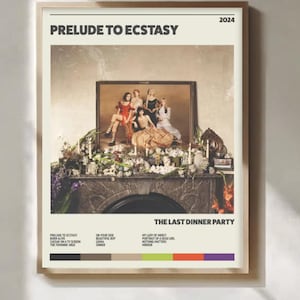 May include: A framed poster with the text "PRELUDE TO ECSTASY" and "2024". The image features a photograph of six people in a room with a fireplace. Below the image are song titles and a color palette. The band name "THE LAST DINNER PARTY" is also displayed.
