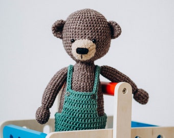 Toy bear in overalls