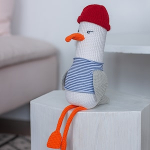 Seagull toy in a red cap