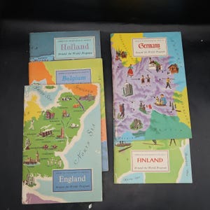 May include: A collection of vintage travel brochures from the American Geographical Society's "Around the World Program." The brochures feature colorful illustrations and maps of Holland, Belgium, England, Germany, and Finland. The brochures are in good condition.
