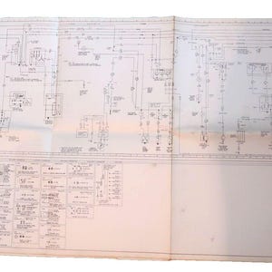 May include: A black and white wiring diagram for a vehicle. The diagram shows the electrical system of the vehicle, including the battery, starter, alternator, and lights. The diagram is labeled with various components and their functions.