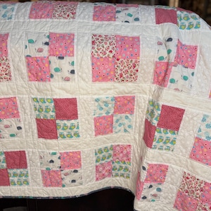 Handmade four patch lap quilt (59.5x68) with snails and owls.