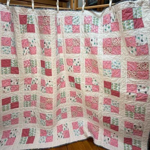 Handmade four patch lap quilt (59.5x68) with snails and owls.