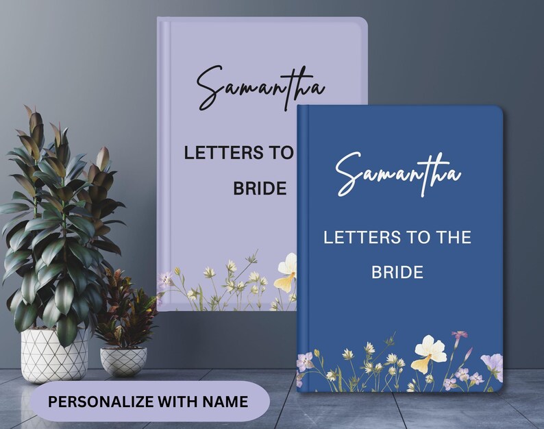 May include: Two personalized notebooks, one lavender and one navy blue, with the name "Samantha" in script. The text "Letters to the Bride" is printed below. Floral accents adorn the bottom of each notebook. The bottom of the image reads "Personalize with Name."