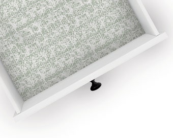 May include: White drawer with a black knob and a green patterned liner.