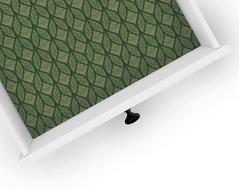 May include: A white drawer with a green and gold patterned liner. The drawer is open and the black knob is visible.