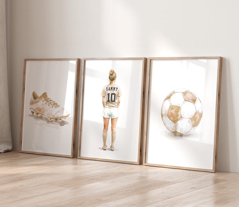 May include: Three framed watercolor illustrations: a white soccer cleat, a female soccer player wearing a white jersey with the name "Sammy" and the number "10" on the back, and a brown and white soccer ball.