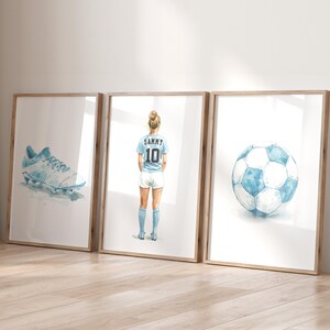 May include: Three framed watercolor illustrations: a soccer cleat, a soccer player wearing a blue jersey with the number 10 and the name "Sammy" on the back, and a soccer ball.