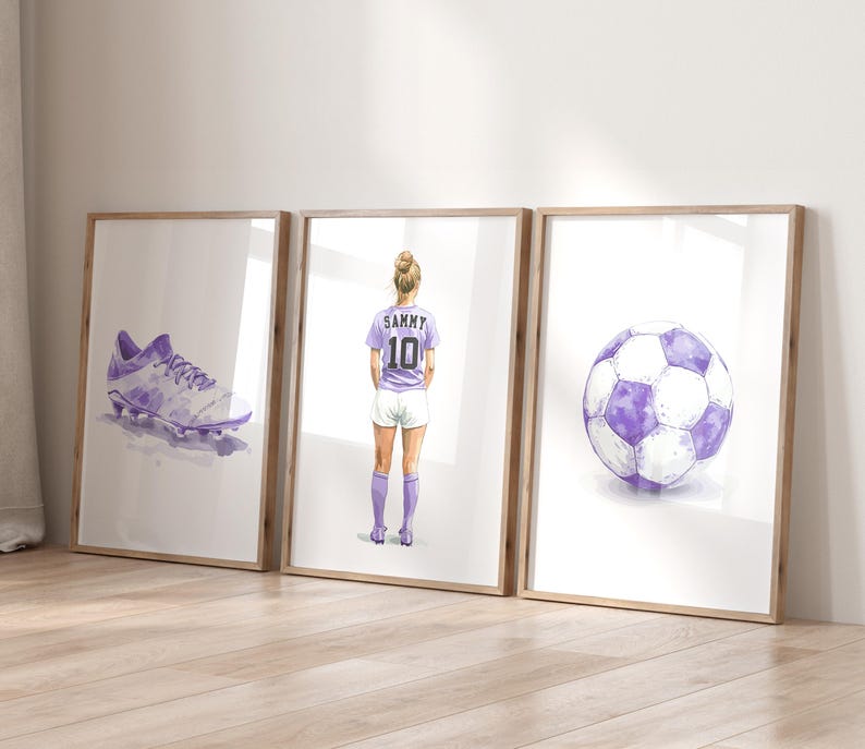 May include: Three framed watercolor illustrations of a soccer player, a soccer ball, and a soccer cleat. The player is wearing a purple jersey with the number 10 and the name Sammy on the back. The soccer ball is purple and white. The soccer cleat is purple and white.