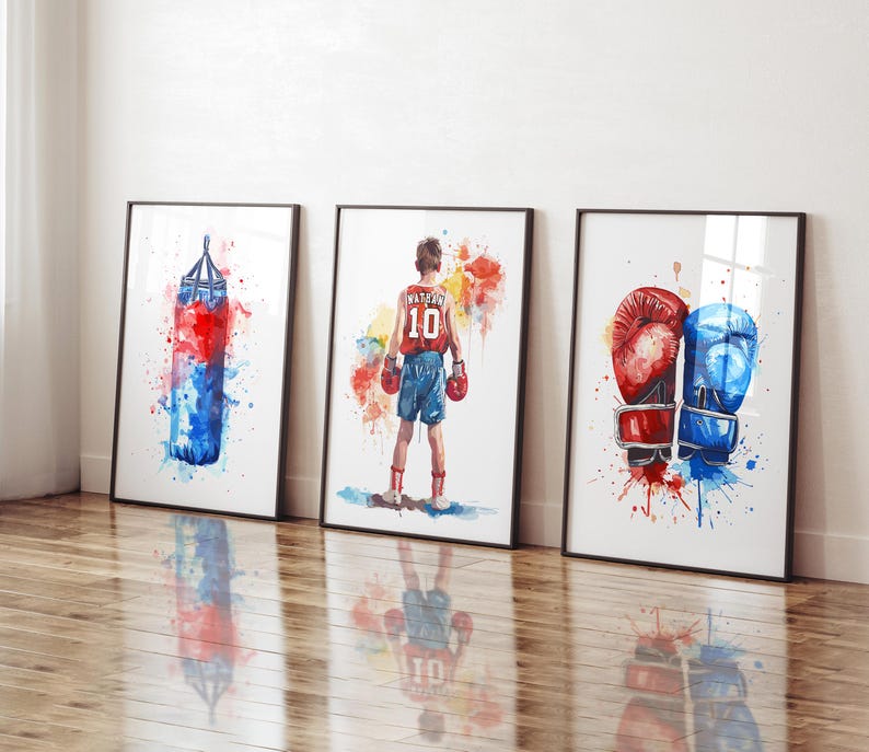 May include: Three watercolor paintings on canvas with a boxing theme. The first painting shows a red and blue boxing bag with watercolors splattered around it. The second painting shows a boxer wearing red shorts and a blue and red jersey with the number 10 on it. The third painting shows a pair of red and blue boxing gloves with watercolors splattered around them.