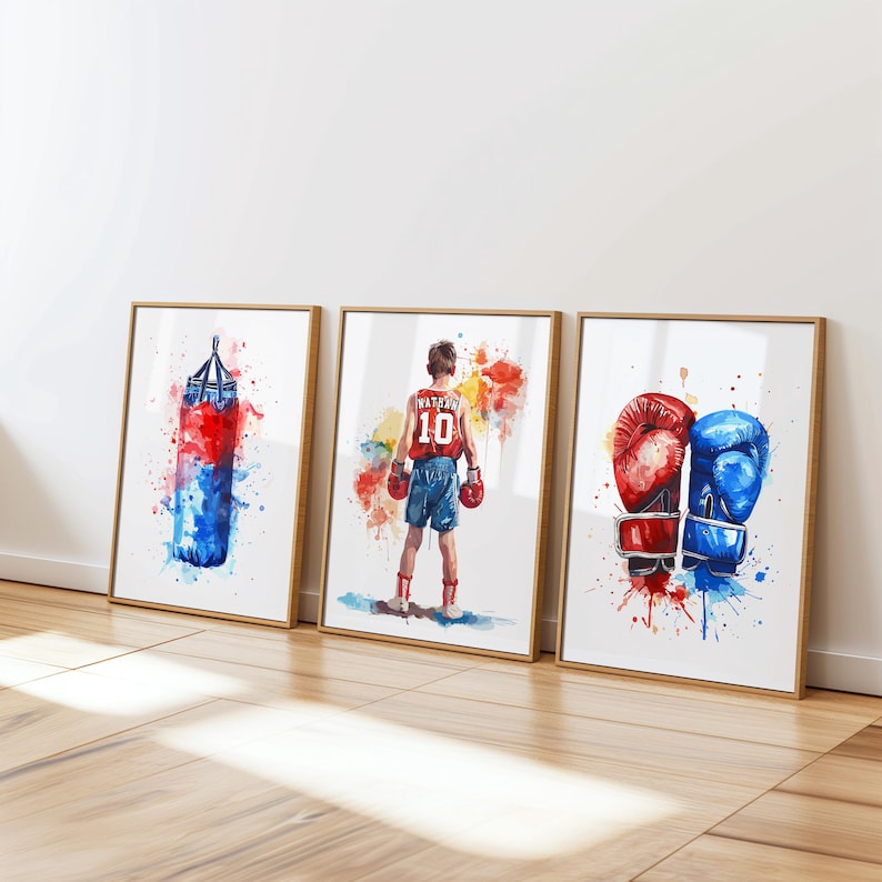 May include: Three framed watercolor paintings depicting boxing imagery. The first painting shows a red and blue boxing bag. The second painting shows a boxer wearing red shorts and a red and white jersey with the number 10 on it. The third painting shows a pair of boxing gloves, one red and one blue.