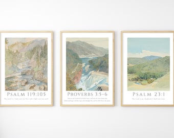 May include: Set of three framed landscape art prints. Each print features a watercolor painting of a natural scene, including mountains, waterfalls, and a river. The prints include text from the Bible: Psalm 119:105, Proverbs 3:5-6, and Psalm 23:1.