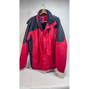 May include: A red and black winter jacket featuring a high collar, a front zipper closure, and long sleeves. The jacket has a color-blocked design with black panels on the shoulders and upper sleeves, and red panels on the chest and lower body.