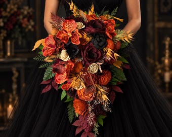 May include: A cascading floral bouquet featuring a mix of orange, deep red, and black flowers. The arrangement includes spotted orange orchids, dark burgundy roses, and various green foliage, creating a textured, teardrop-shaped display.