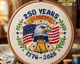 May include: A cross-stitch pattern in a wooden hoop, featuring an American flag, an eagle, and the Liberty Bell. The text reads "250 Years of Freedom 1776-2026". The words "PDF of Cross Stitch Pattern" and "Easy Stitch" are also visible.