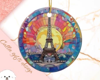 May include: A round, colorful, stained glass ornament featuring the Eiffel Tower in Paris, France. The ornament has a red, orange, yellow, green, blue, and purple color scheme.