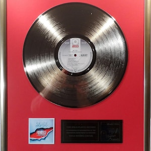Collage with AC/DC The Razors Edge gold record gold record