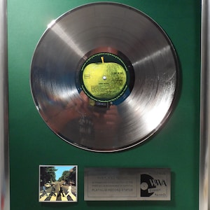 Collage with The Beatles - Abbey Road + silver / gold record