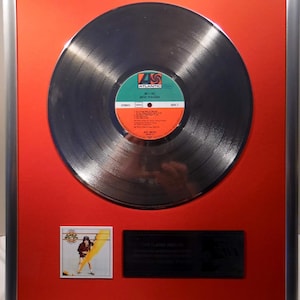 Collage with AC/DC, high voltage + silver / gold record